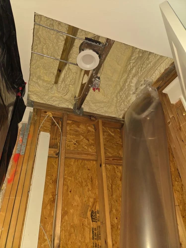 Opened wall cavity with drying duct in place